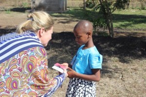 Agape Shedrack receiving her gift from Holly and Lloyd